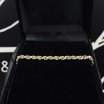 Gevlochten armband geel