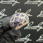 Zilveren ring met paarse stenen